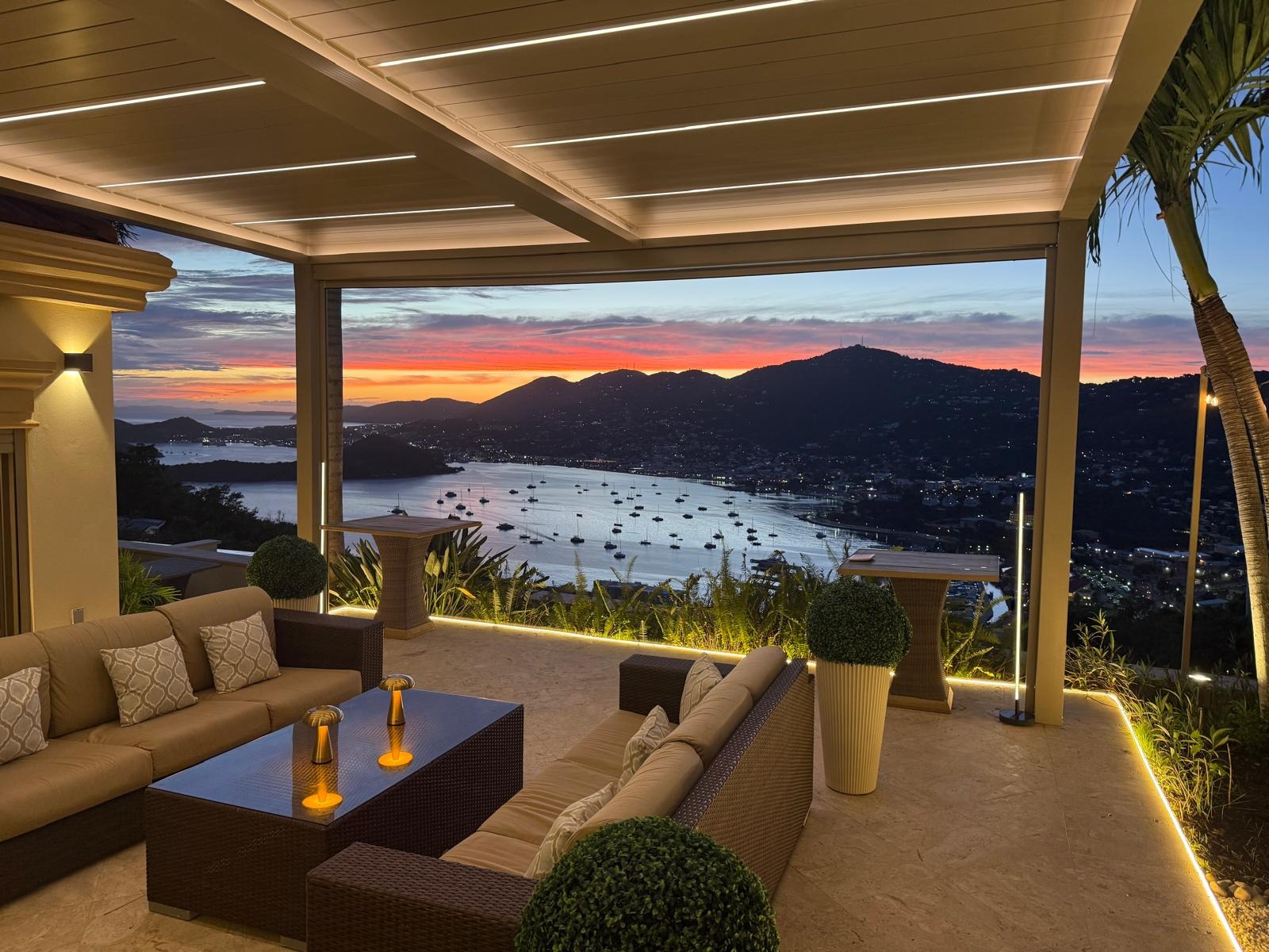 Modern matte black pergola on a luxury rooftop terrace